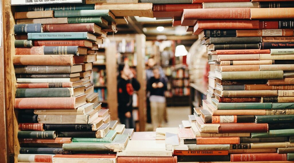 Stack of books arranged so there is a hole in the middle.